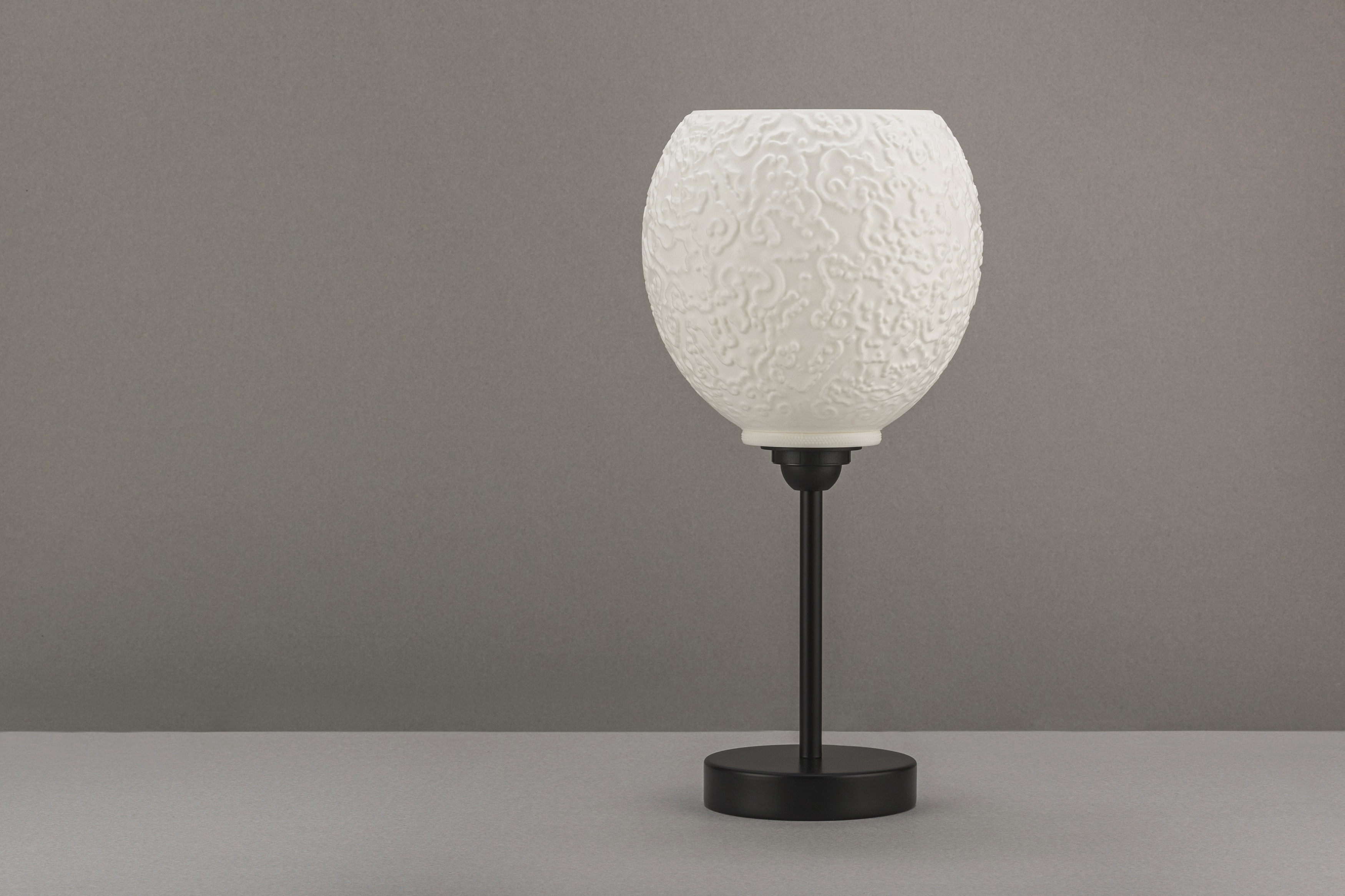 Decorative suggestion for Alluvial Crush: Pendant lampshade with captivating glyph pattern. Science and art fusion, perfect as a conversation starter - variant Original (Elegant white), an original product by Cosmic Jubilee (4 of 6) - presented as desktop, table, or freestanding light, switched off.