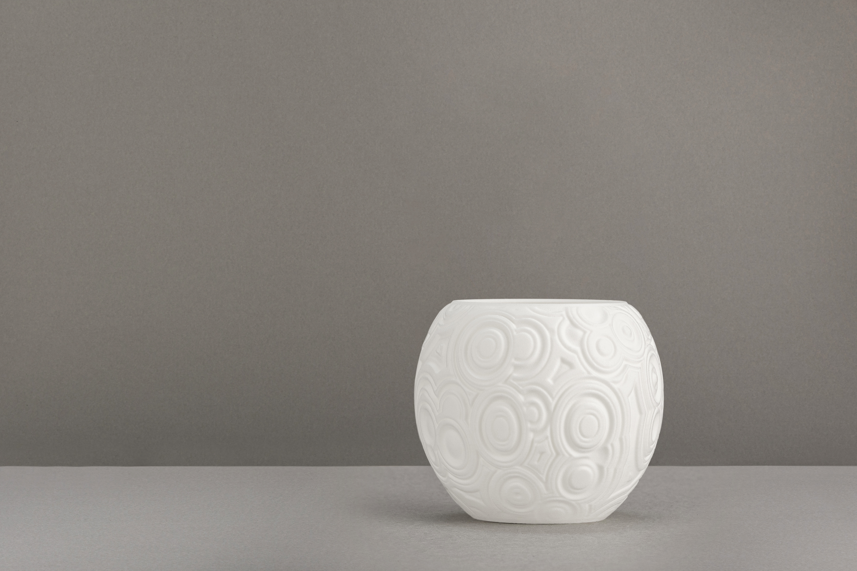 Decorative suggestion for Celestial Odyssey: Tealight holder with cosmic design. Perfect for stargazers and dreamers - variant Original (Elegant white), an original product by Cosmic Jubilee (2 of 3) - presented as a tealight, switched off.