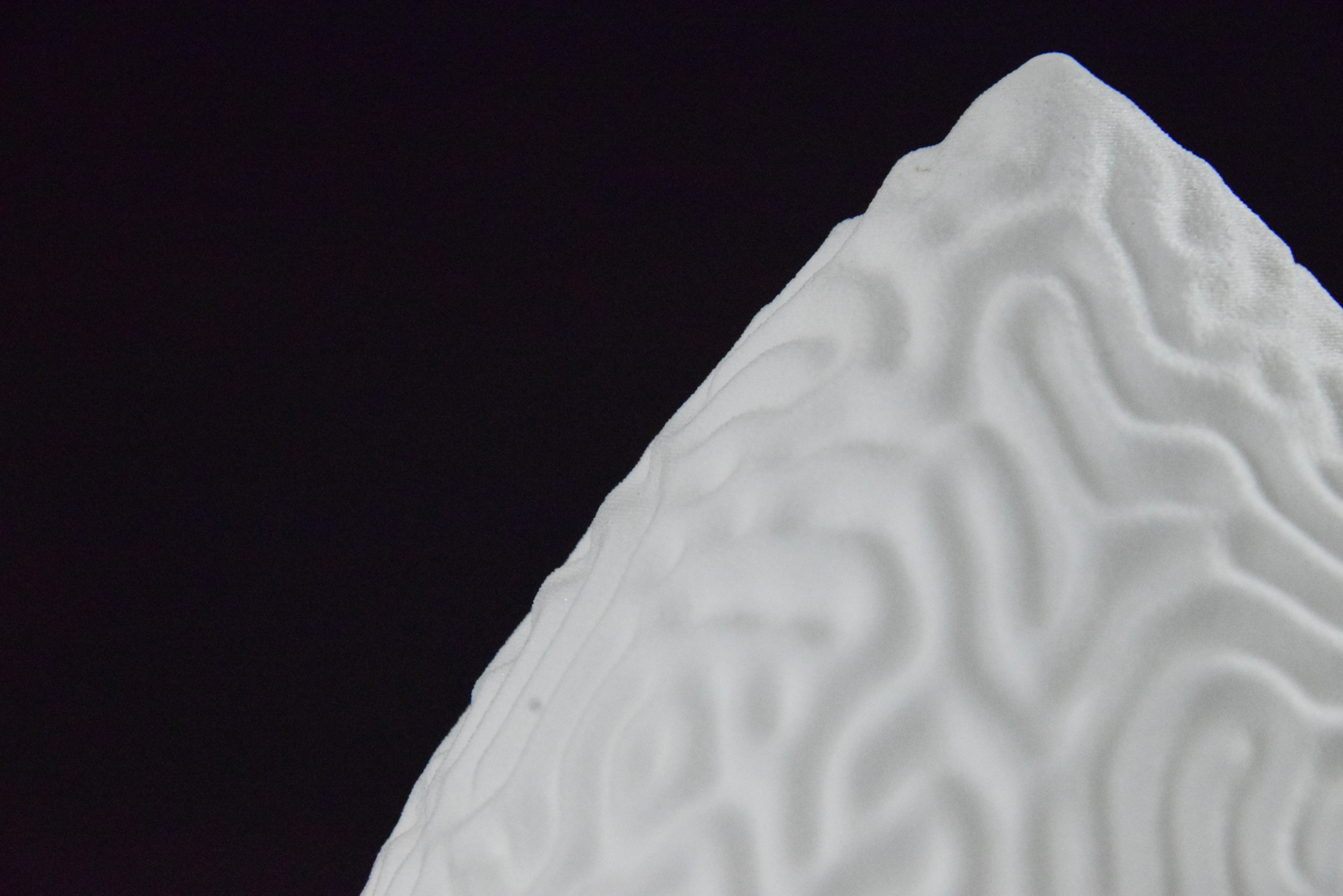 Decorative suggestion for Cosmic Drop: Desktop light with cosmic design. Encapsulates the beauty of the cosmos - variant Aeolian Plains (Elegant white), an original product by Cosmic Jubilee (5 of 5) - presented as close-up details of fine textures.