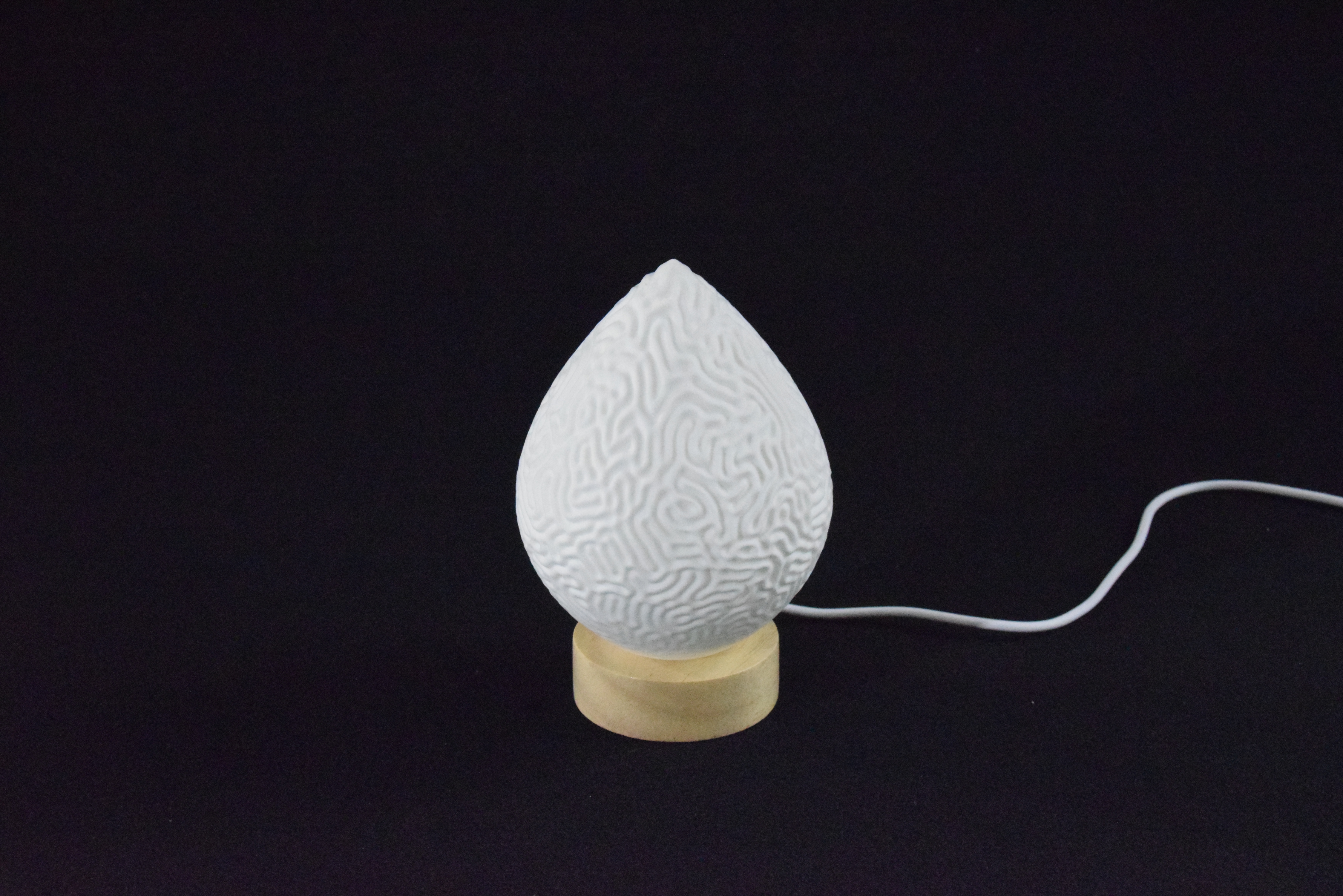 Decorative suggestion for Cosmic Drop: Desktop light with cosmic design. Encapsulates the beauty of the cosmos - variant Aeolian Plains (Elegant white), an original product by Cosmic Jubilee (2 of 5) - presented as desktop, table, or freestanding light, switched off.
