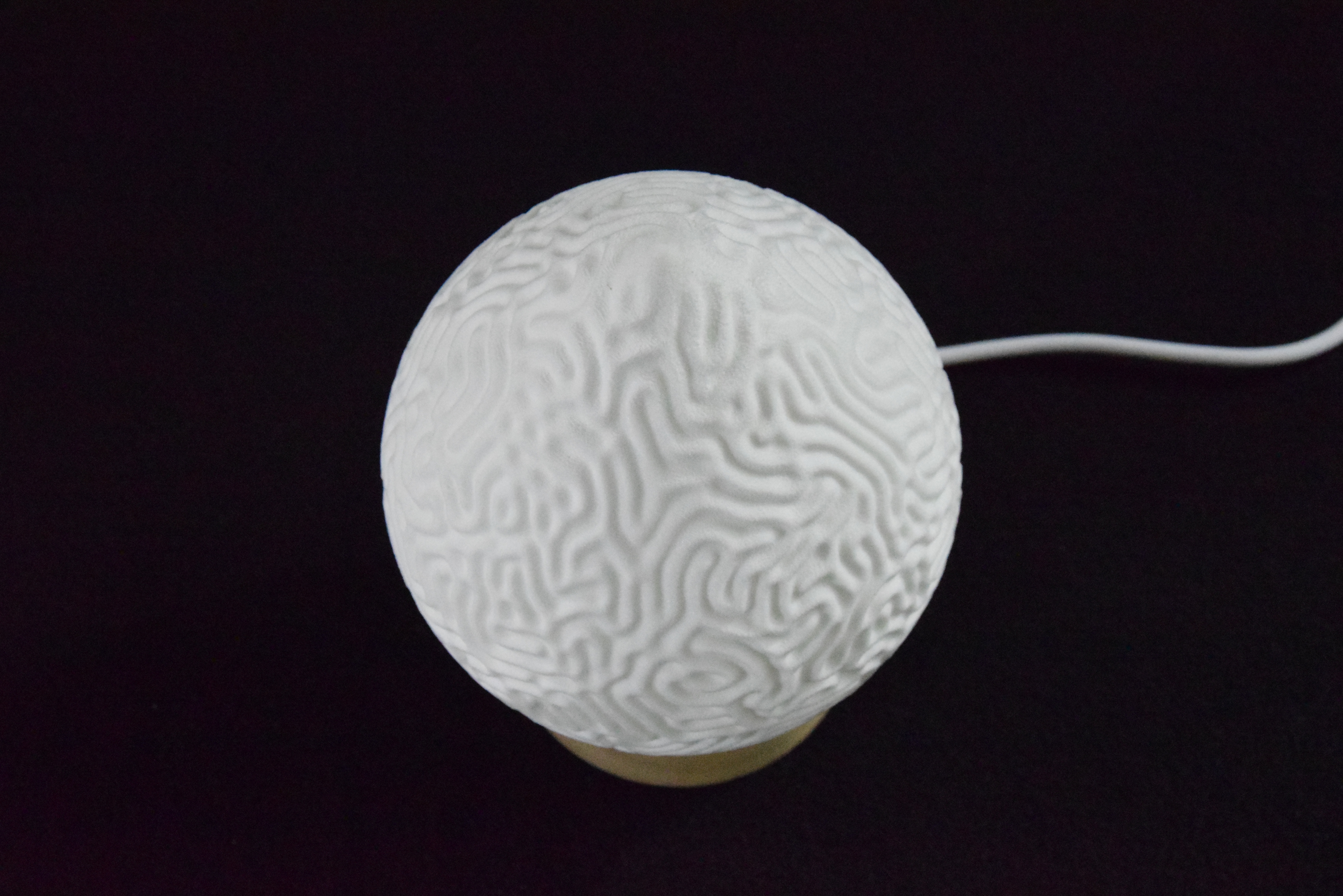 Decorative suggestion for Cosmic Drop: Desktop light with cosmic design. Encapsulates the beauty of the cosmos - variant Aeolian Plains (Elegant white), an original product by Cosmic Jubilee (4 of 5) - presented as desktop, table, or freestanding light, switched off.
