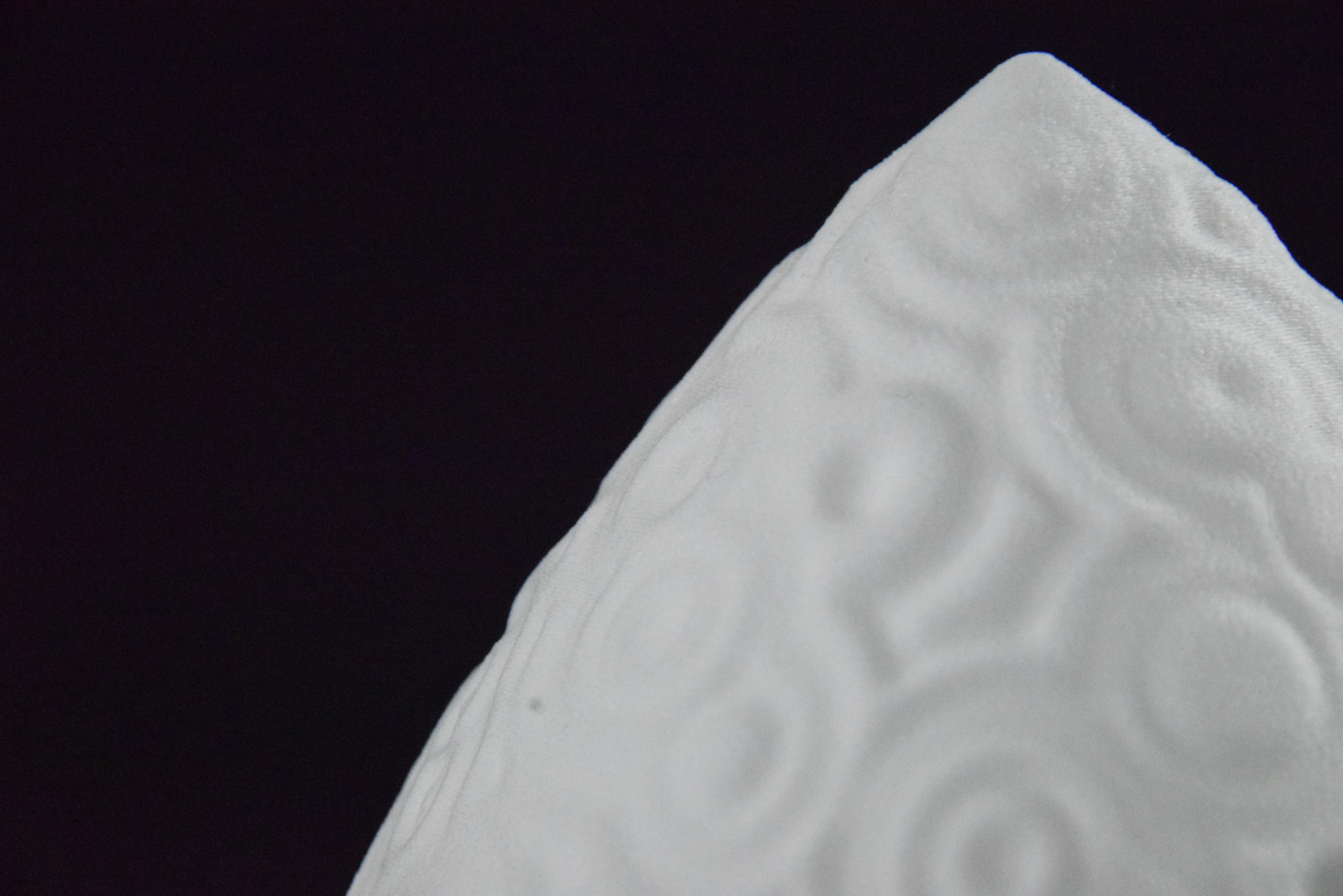 Decorative suggestion for Cosmic Drop: Desktop light with cosmic design. Encapsulates the beauty of the cosmos - variant Celestial Odyssey (Elegant white), an original product by Cosmic Jubilee (5 of 5) - presented as close-up details of fine textures.