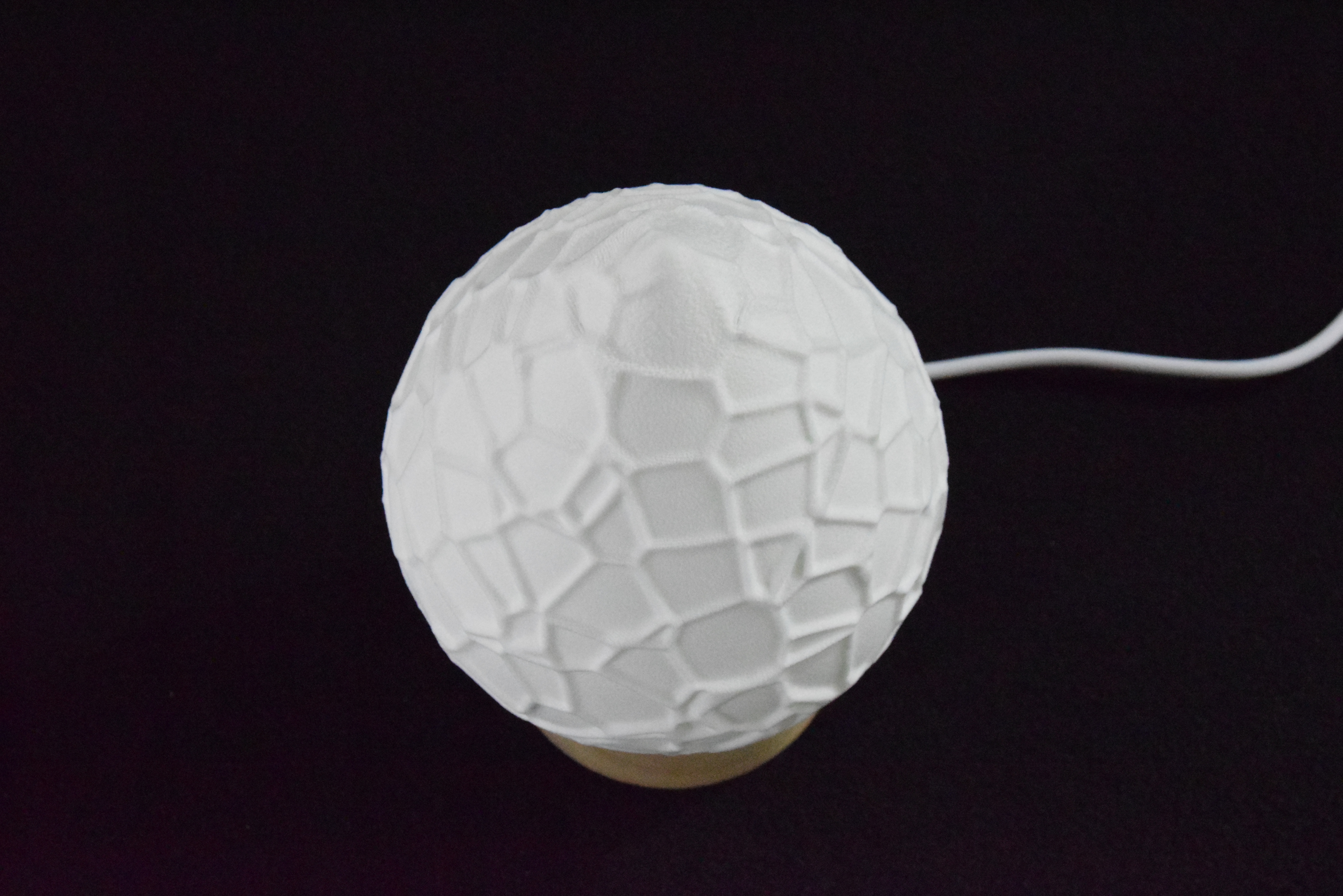 Decorative suggestion for Cosmic Drop: Desktop light with cosmic design. Encapsulates the beauty of the cosmos - variant Petrified Shallows (Elegant white), an original product by Cosmic Jubilee (4 of 5) - presented as desktop, table, or freestanding light, switched off.