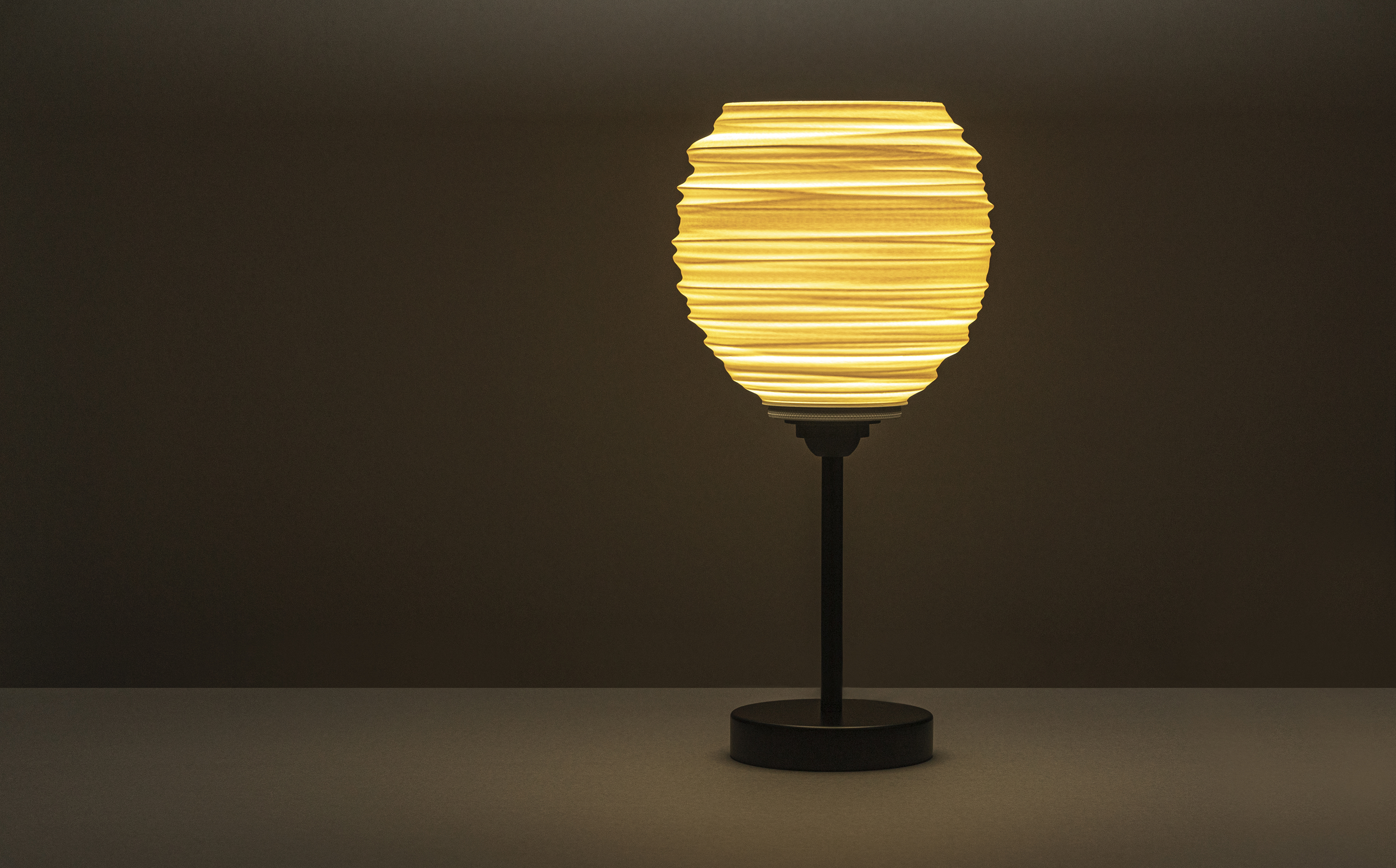 Decorative suggestion for Magma Shroud: Pendant lampshade mirroring tumultuous magma flow. Adds an elemental touch to modern decor - variant Original (Creme and beige diffuse light), an original product by Cosmic Jubilee (3 of 6) - presented as desktop, table, or freestanding light, switched on.