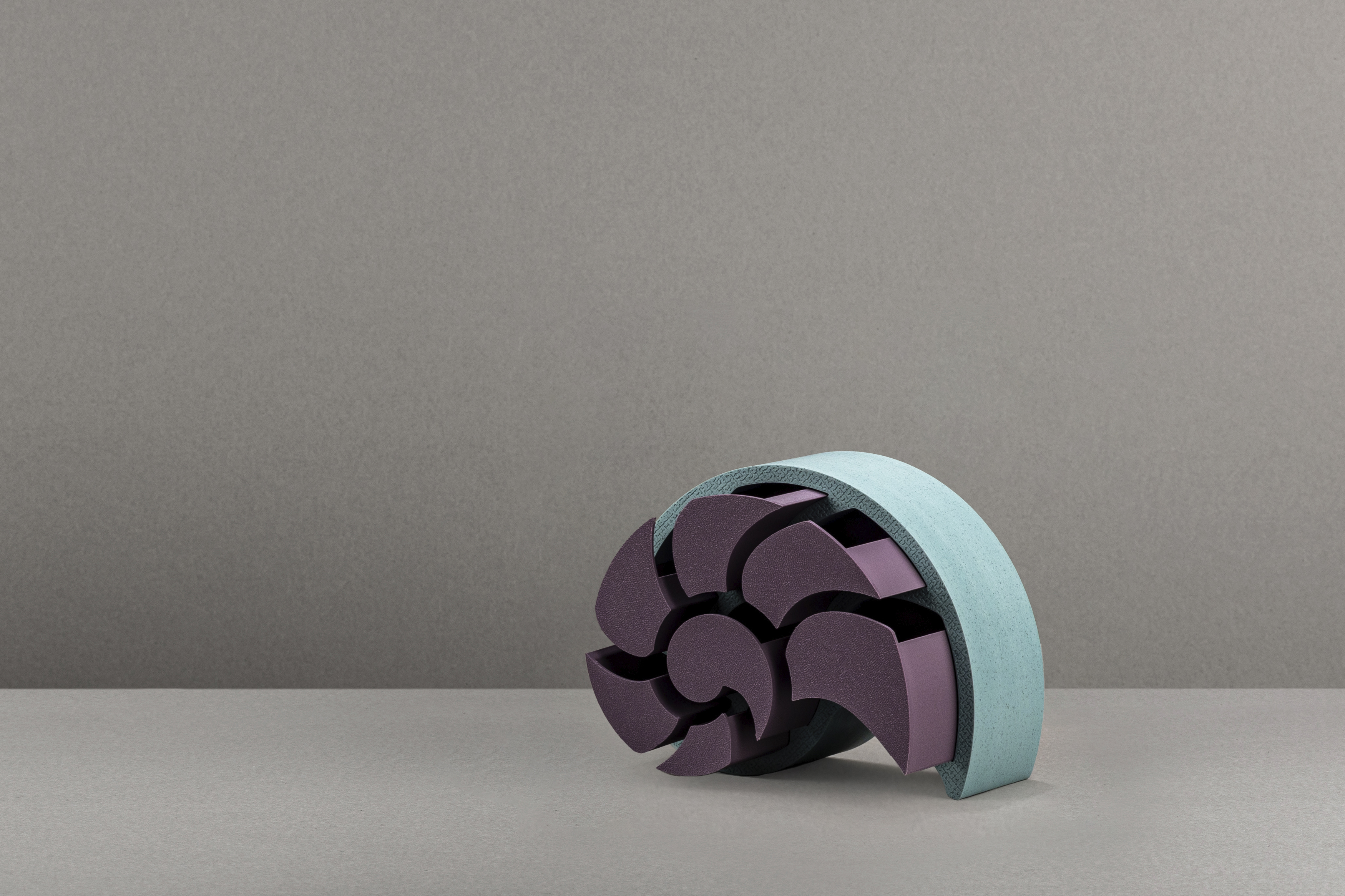 Decorative suggestion for Nausicaa's Treasure: Jewelry or trinket box modeled after the chambered nautilus shell. Ancient memories and echoes of the deep sea coalesce into a vessel for your valuables - variant Atlantis (Turqoise tones), an original product by Cosmic Jubilee (3 of 5) - presented as all drawers open.