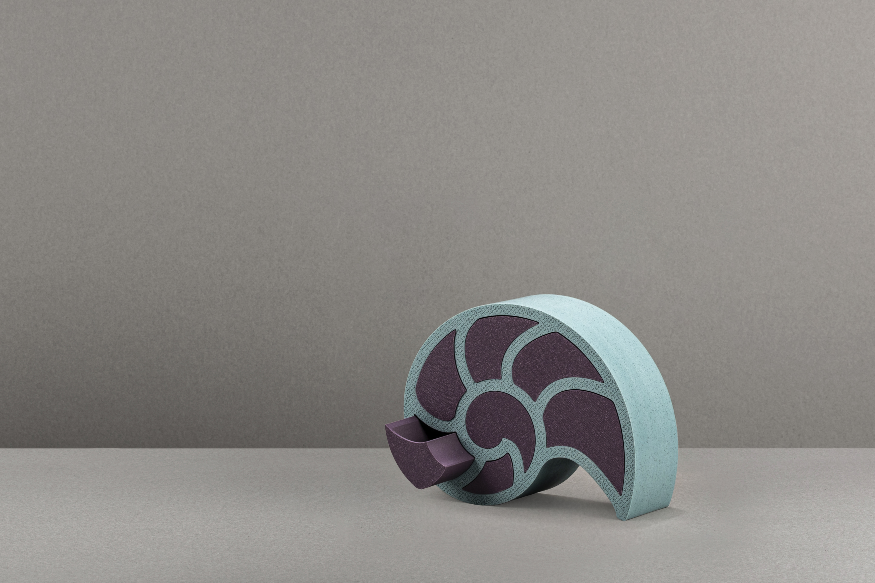 Decorative suggestion for Nausicaa's Treasure: Jewelry or trinket box modeled after the chambered nautilus shell. Ancient memories and echoes of the deep sea coalesce into a vessel for your valuables - variant Atlantis (Turqoise tones), an original product by Cosmic Jubilee (2 of 5) - presented as single drawer open.