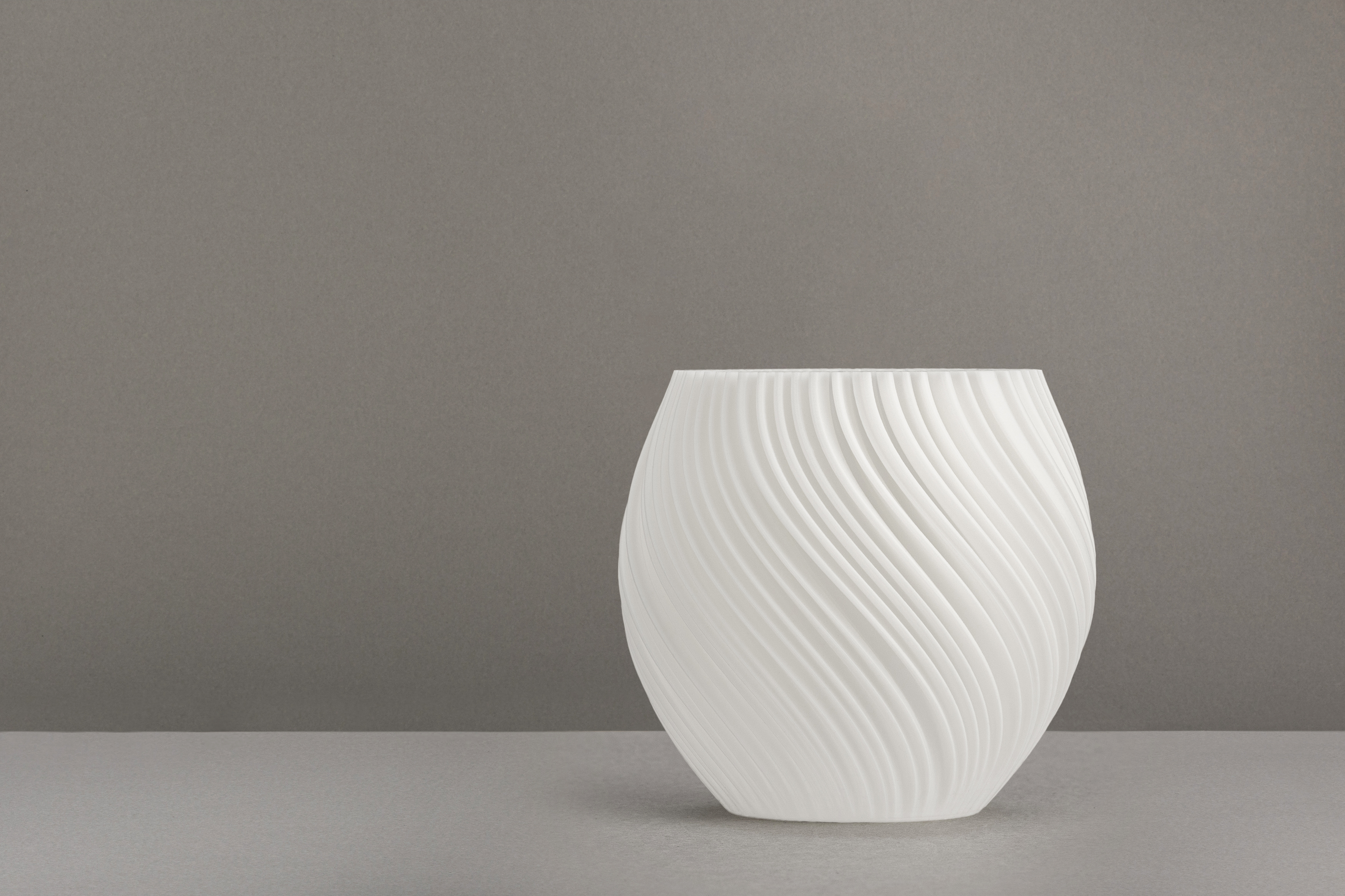 Decorative suggestion for Pellucid Sweep: Tealight holder with flush, velvety filaments. Offers a crystalline aspect to any elegant setting - variant Original (Milky white), an original product by Cosmic Jubilee (2 of 3) - presented as a tealight, switched off.