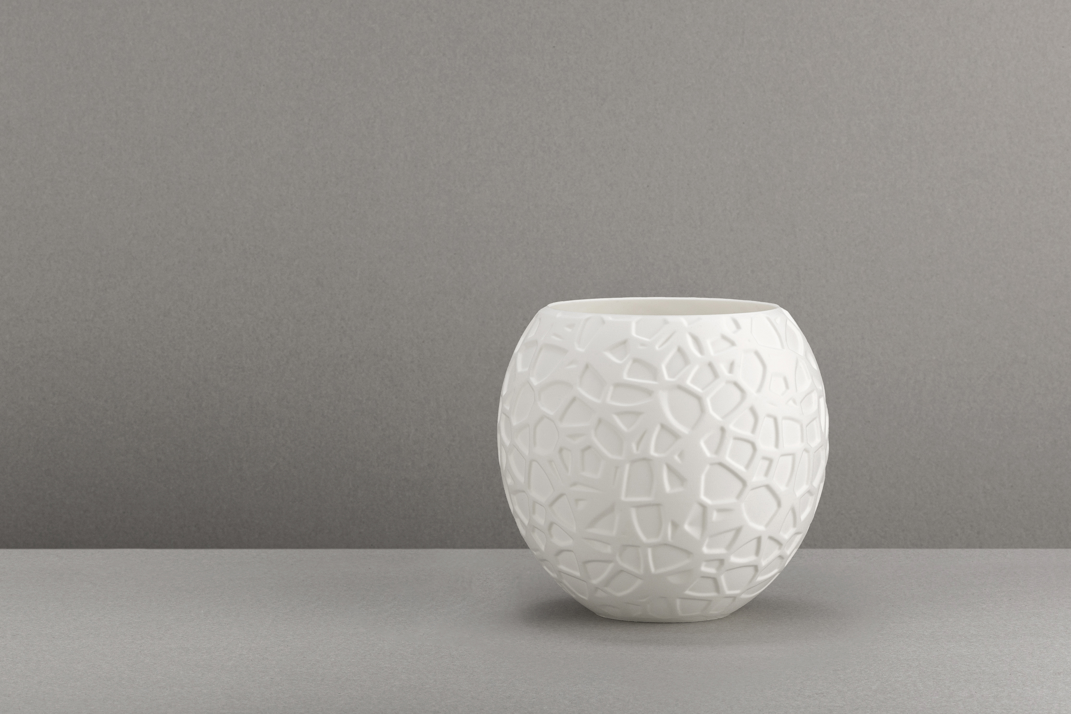 Decorative suggestion for Petrified Shallows: Pendant lampshade with timeless Voronoi design. Ideal for adding depth and history to your space - variant Original (Elegant white), an original product by Cosmic Jubilee (5 of 6) - presented as a decorative (non-water) vase or standalone showpiece.