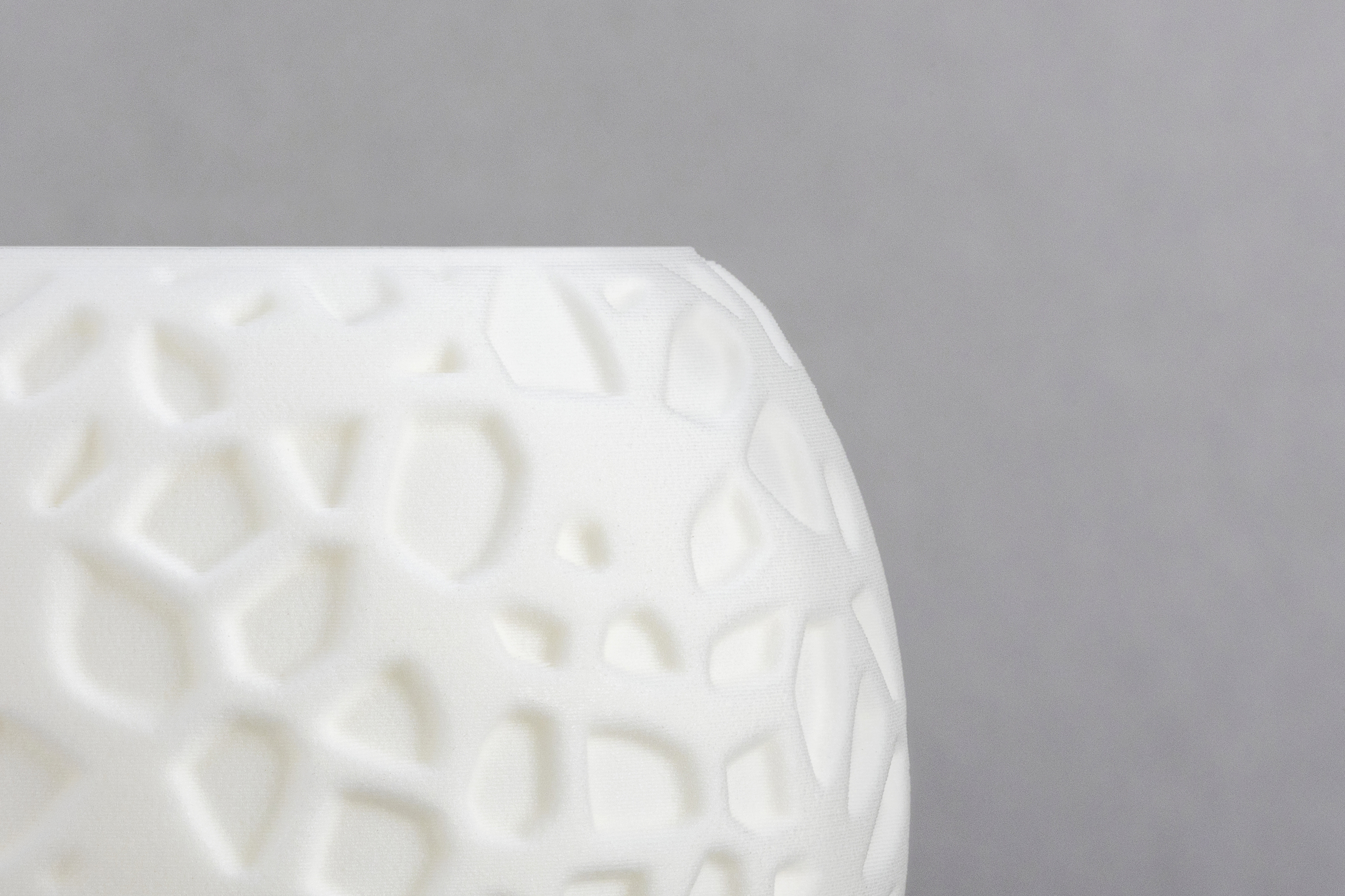 Decorative suggestion for Petrified Shallows: Voronoi pattern tealight holder echoing life's journeys. Warm glow casting memories and paths in light - variant Original (Elegant white), an original product by Cosmic Jubilee (3 of 3) - presented as close-up details of fine textures.