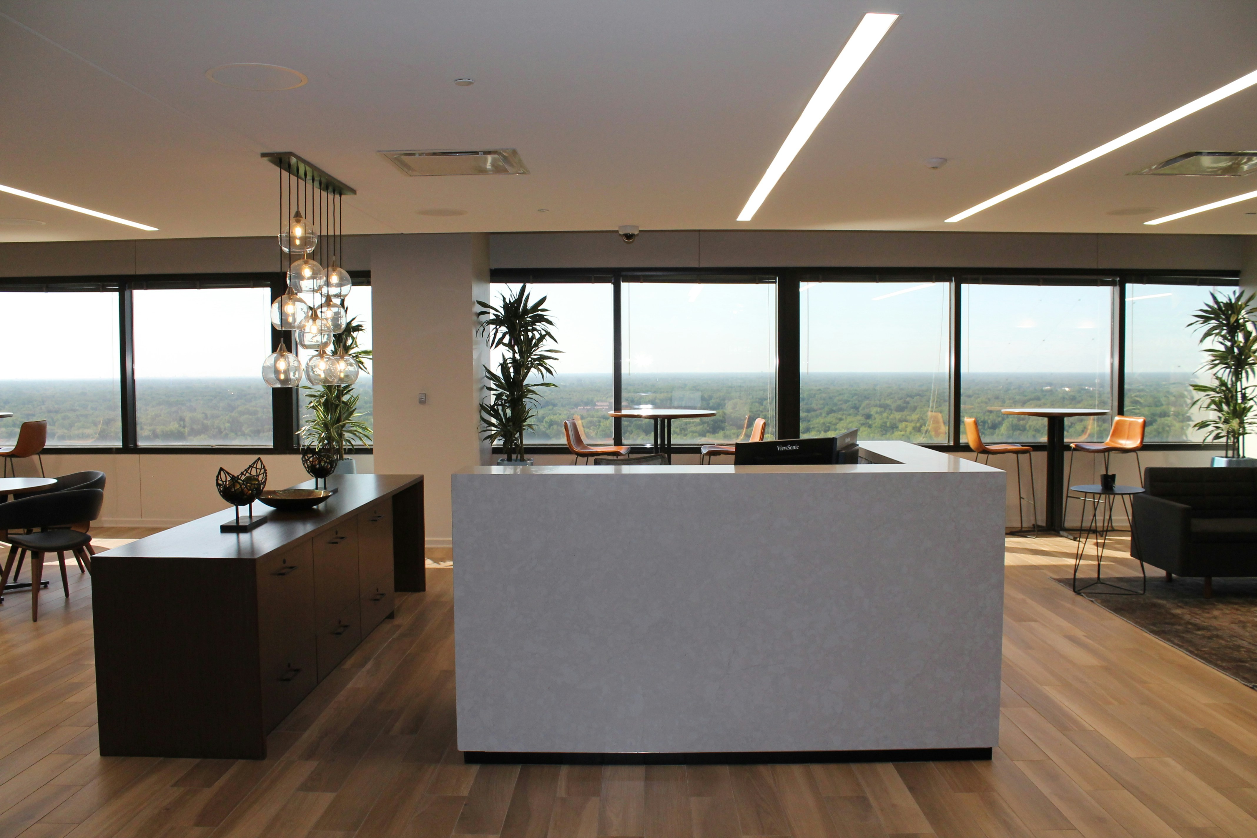 The lobby represents the first impression of a company. Lighting should be inviting and professional, using fixtures that complement the company's brand and design aesthetic. Consider dramatic lighting to highlight features.