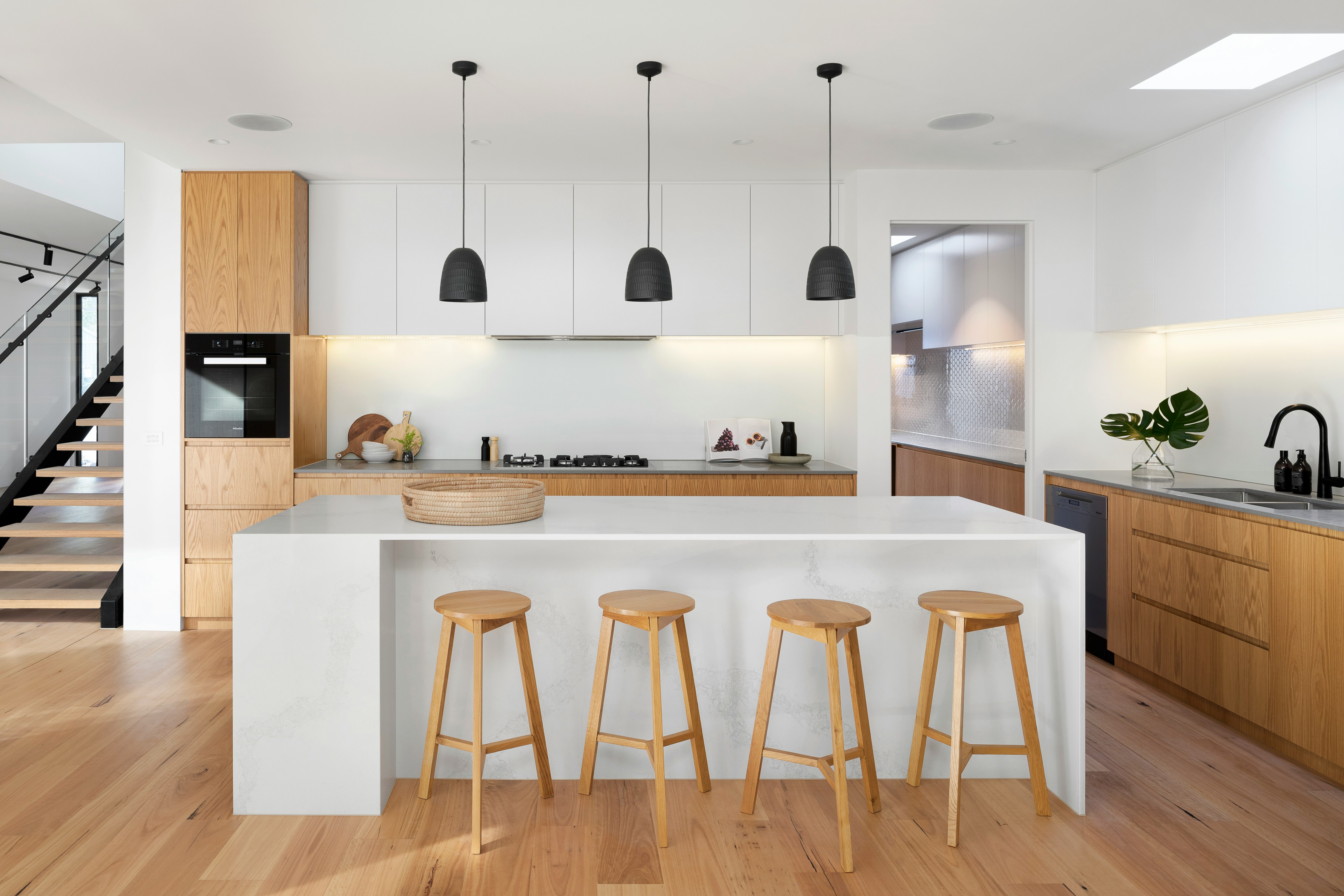 The kitchen is the culinary hub of the home, blending functionality with warmth. Lighting here should be bright and focused, illuminating work areas for safety and efficiency while adding softer lights for dining and socializing.